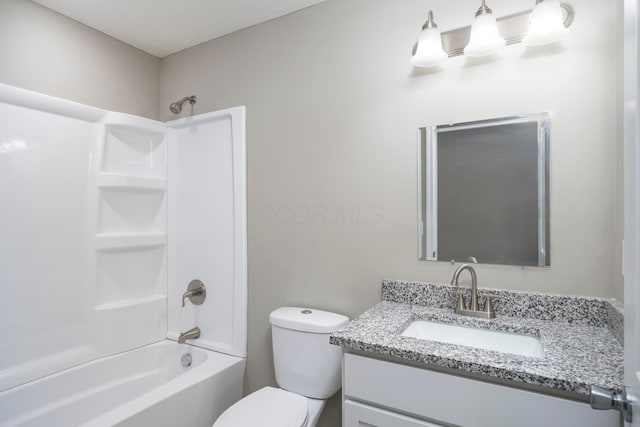 full bathroom with shower / tub combination, vanity, and toilet