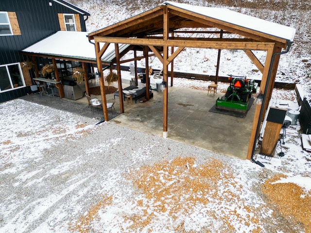 snow covered patio with exterior kitchen