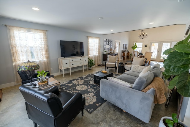 living room featuring a wealth of natural light and french doors