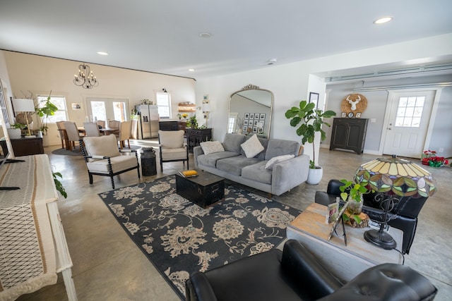 living room featuring a notable chandelier