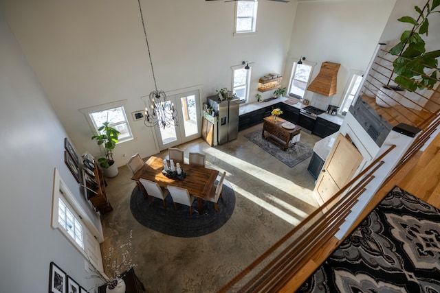 living room featuring a high ceiling and plenty of natural light