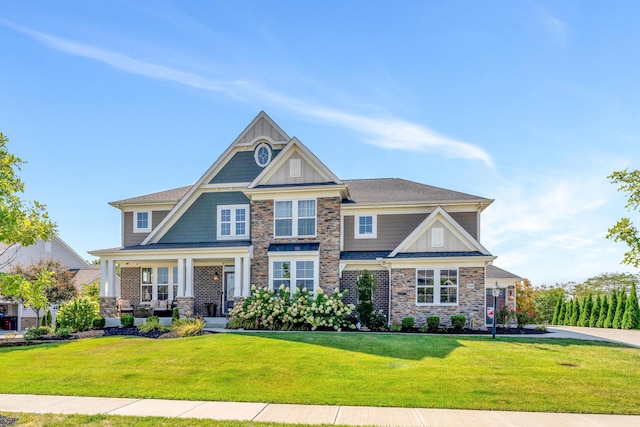 craftsman house featuring a front lawn