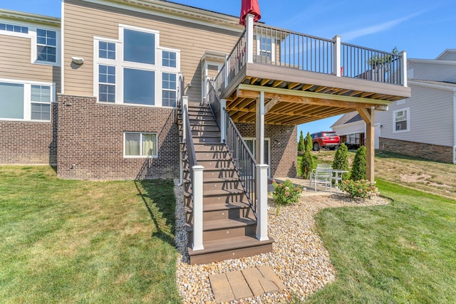 rear view of house with a lawn, a patio, and a deck