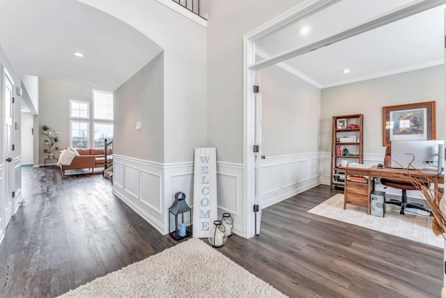 corridor featuring dark wood-type flooring and ornamental molding