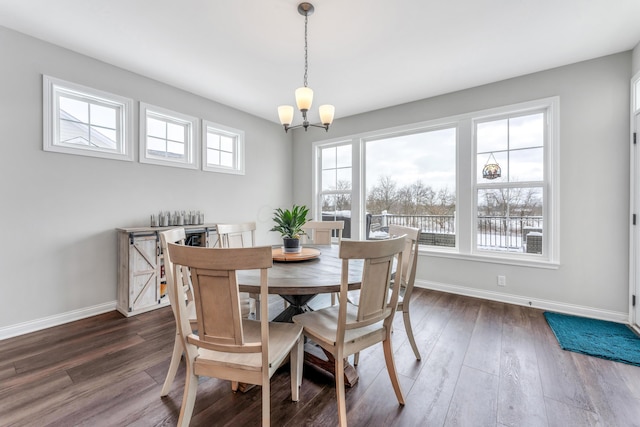 dining area featuring a notable chandelier and dark hardwood / wood-style floors