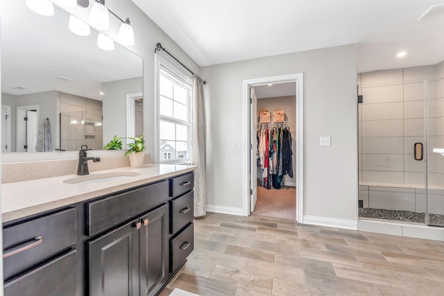 bathroom featuring vanity and walk in shower