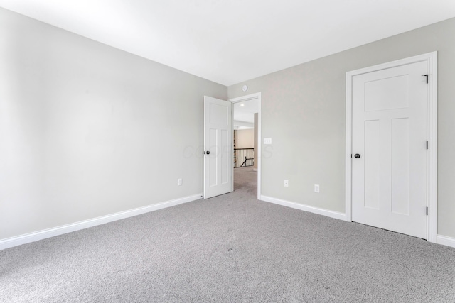 unfurnished bedroom with carpet