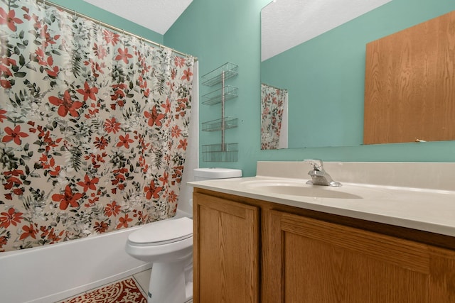 full bathroom featuring vanity, toilet, shower / bath combo with shower curtain, and a textured ceiling