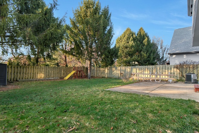 view of yard featuring central AC unit and a patio area