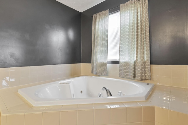 bathroom with a relaxing tiled tub