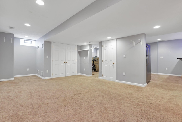 basement featuring light colored carpet