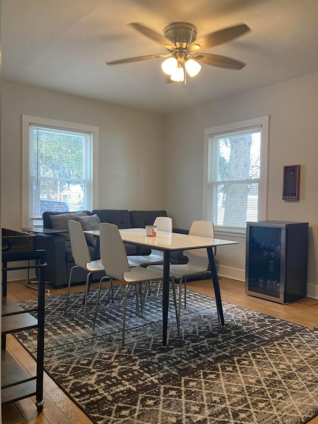 dining area featuring hardwood / wood-style flooring, ceiling fan, and a healthy amount of sunlight