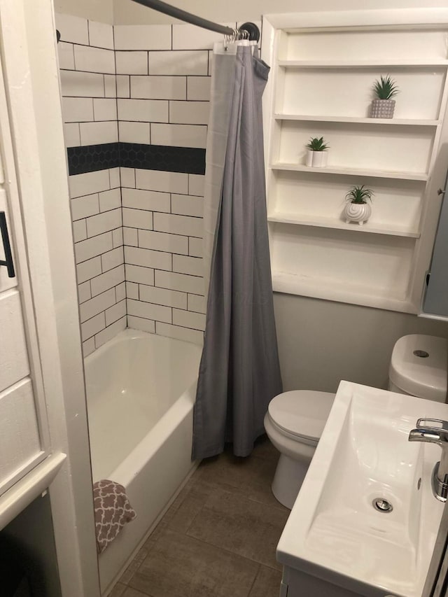 full bathroom with toilet, shower / bath combo with shower curtain, and sink