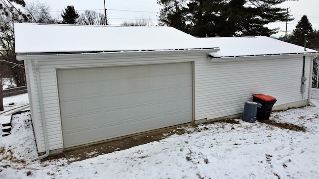 view of snow covered garage