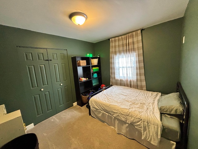 bedroom with carpet and a closet