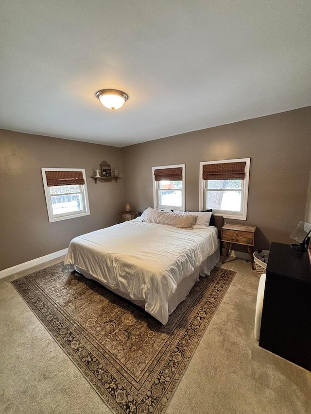 bedroom with light colored carpet