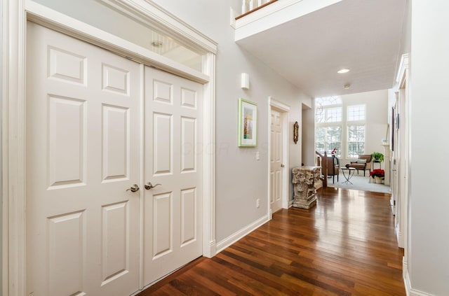 corridor featuring dark hardwood / wood-style flooring