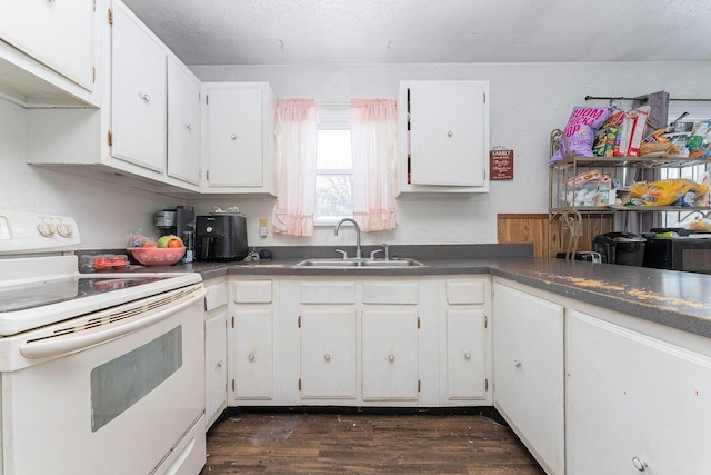 kitchen with dark hardwood / wood-style flooring, white cabinetry, sink, and white electric range oven