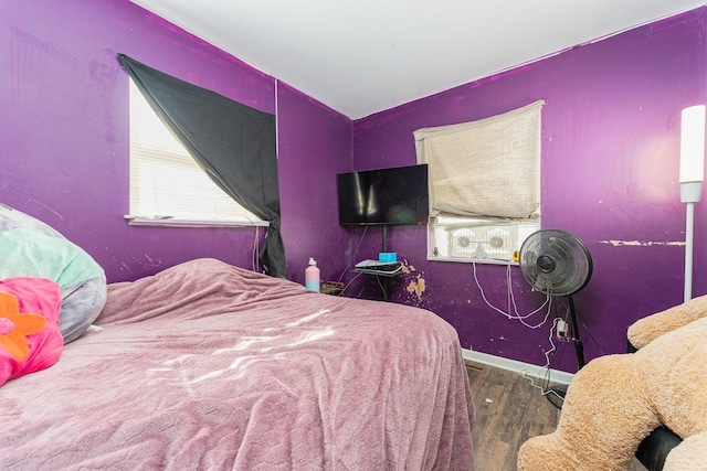 bedroom with wood-type flooring