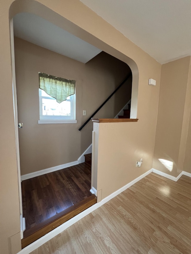 staircase featuring hardwood / wood-style floors