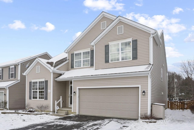 front of property with a garage