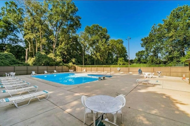 view of swimming pool featuring a patio