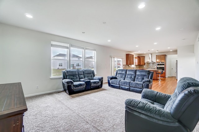 living room featuring light colored carpet