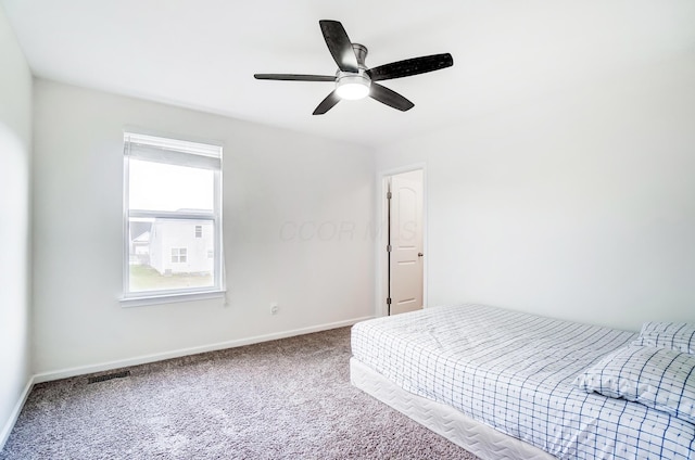 bedroom with ceiling fan and carpet floors