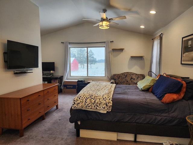 carpeted bedroom featuring ceiling fan and vaulted ceiling