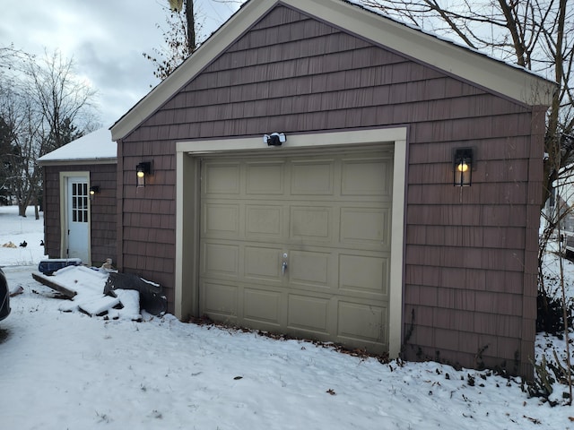 view of snow covered garage