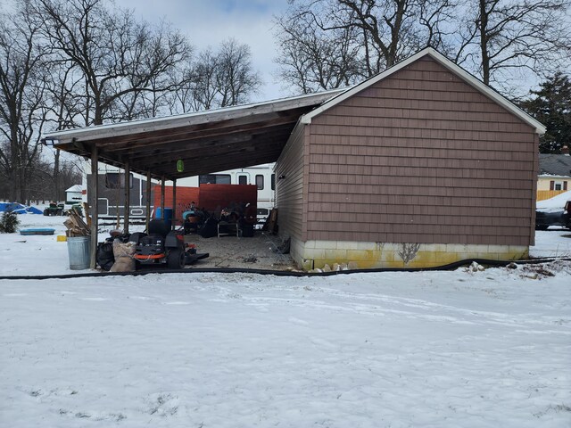 exterior space with a carport