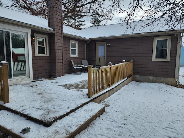 view of snow covered house