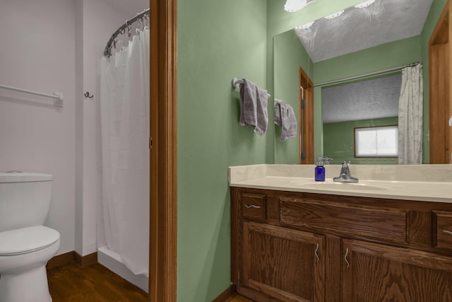 bathroom featuring hardwood / wood-style flooring, vanity, toilet, and a shower with curtain