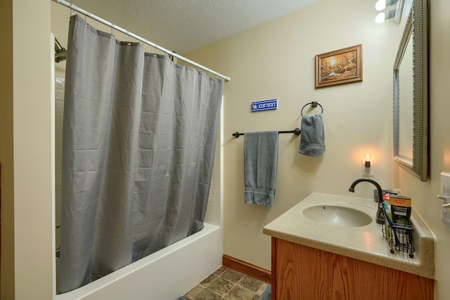 bathroom featuring vanity, shower / bathtub combination with curtain, and a textured ceiling