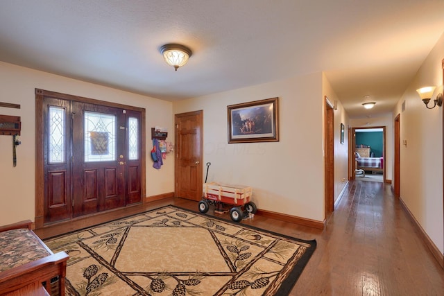 entryway with wood-type flooring