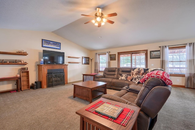 living room featuring ceiling fan, light colored carpet, and vaulted ceiling