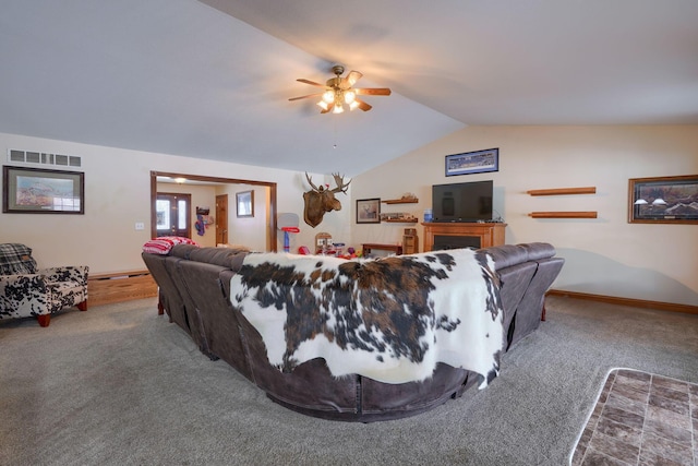 carpeted living room featuring vaulted ceiling and ceiling fan