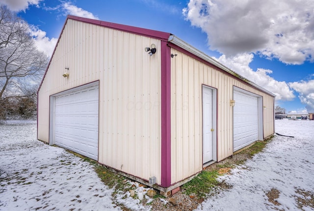 view of snow covered garage