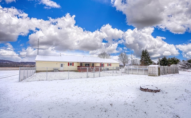 snowy yard with central AC unit