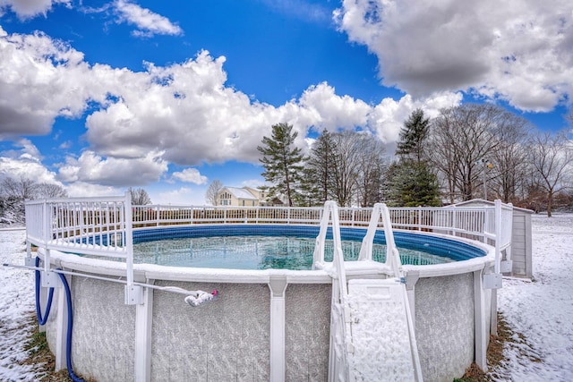 view of snow covered pool