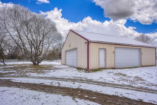 view of snow covered garage