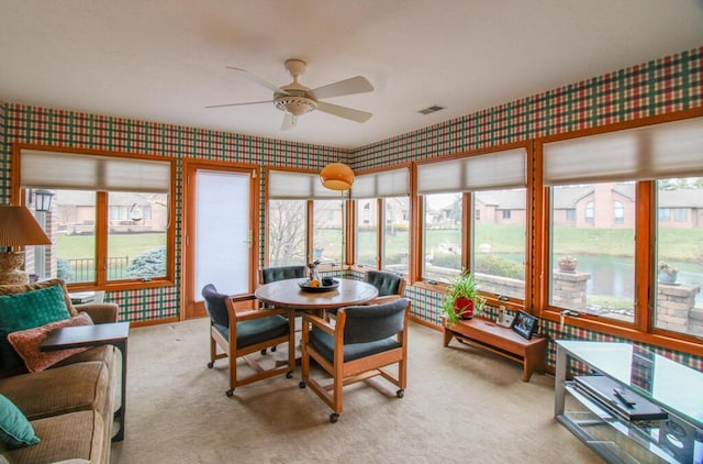 sunroom / solarium with ceiling fan