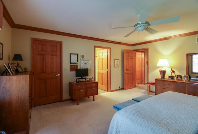 carpeted bedroom with ceiling fan and crown molding