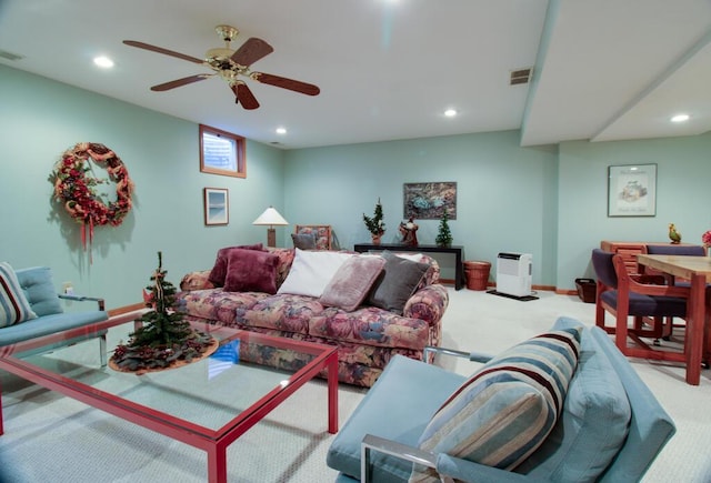 living room with light carpet and ceiling fan