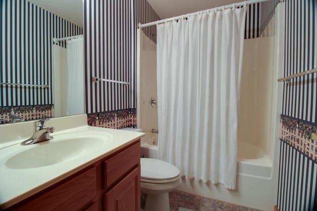 full bathroom featuring tile patterned flooring, shower / bath combination with curtain, toilet, and vanity