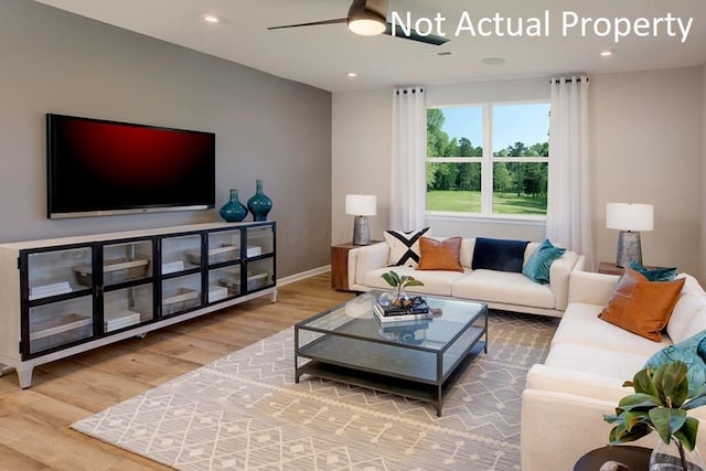 living area featuring a ceiling fan, recessed lighting, baseboards, and wood finished floors