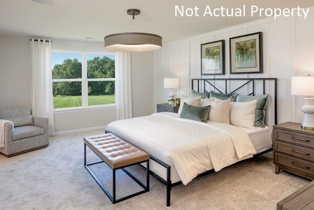 bedroom with light colored carpet