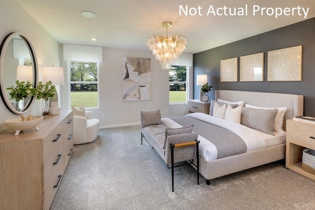 bedroom featuring light carpet and an inviting chandelier