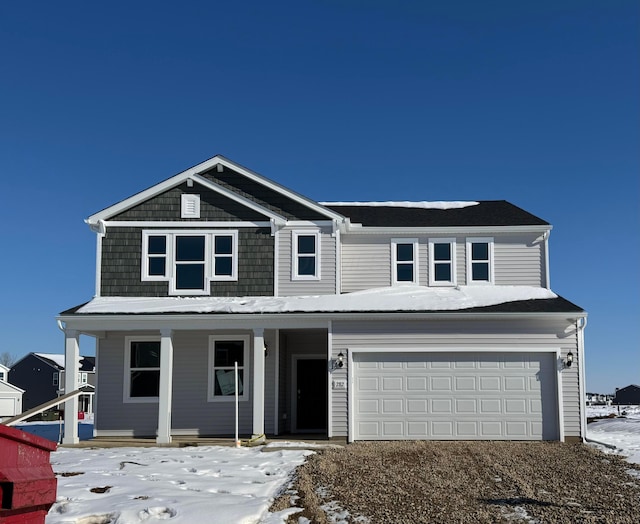 view of front facade with a garage and a porch