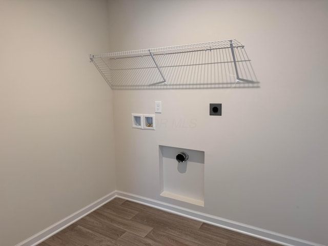 laundry area with dark hardwood / wood-style floors, hookup for a washing machine, and electric dryer hookup